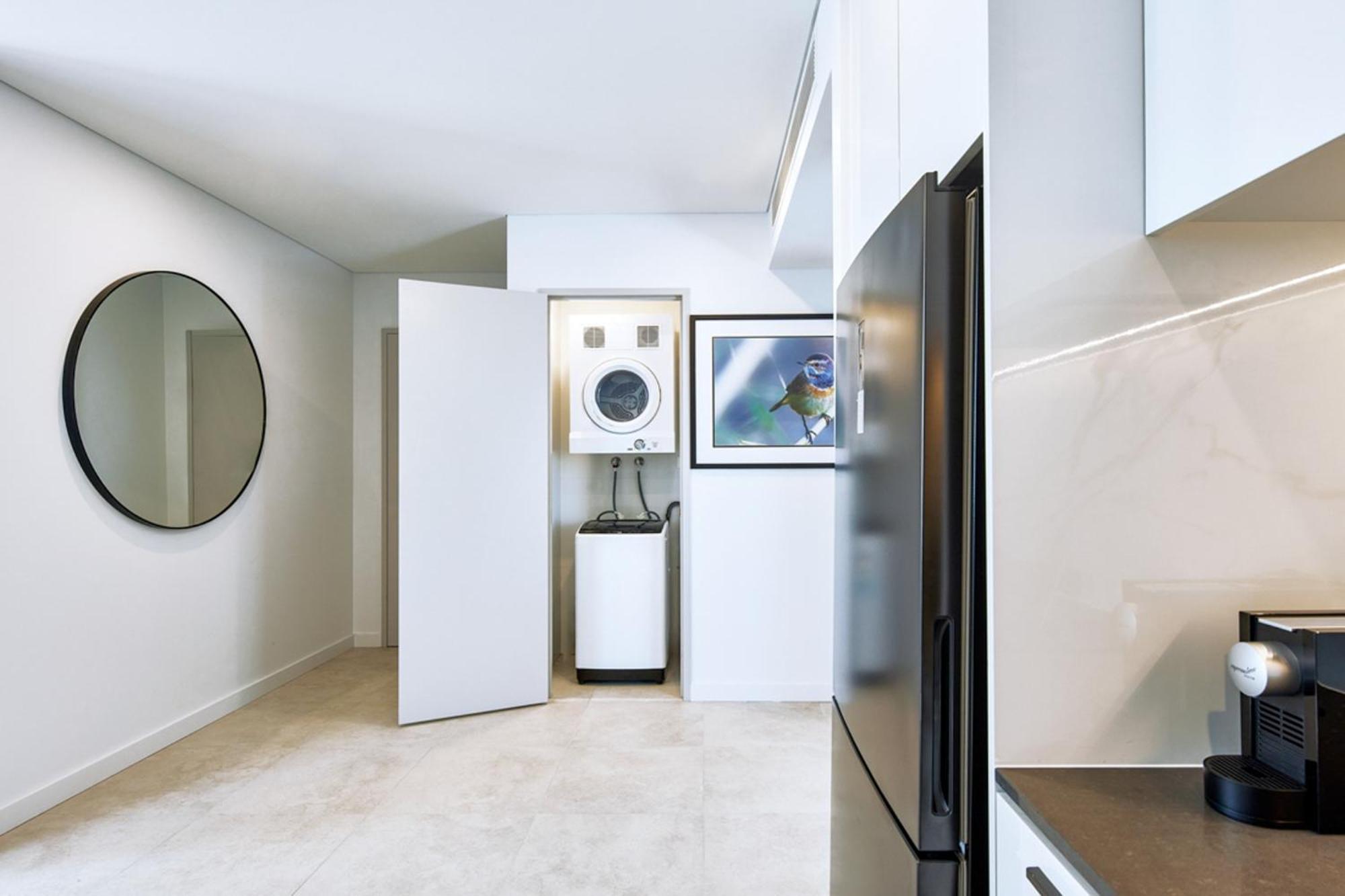 Meriton Suites Liverpool Exterior photo A laundry room in a residential apartment