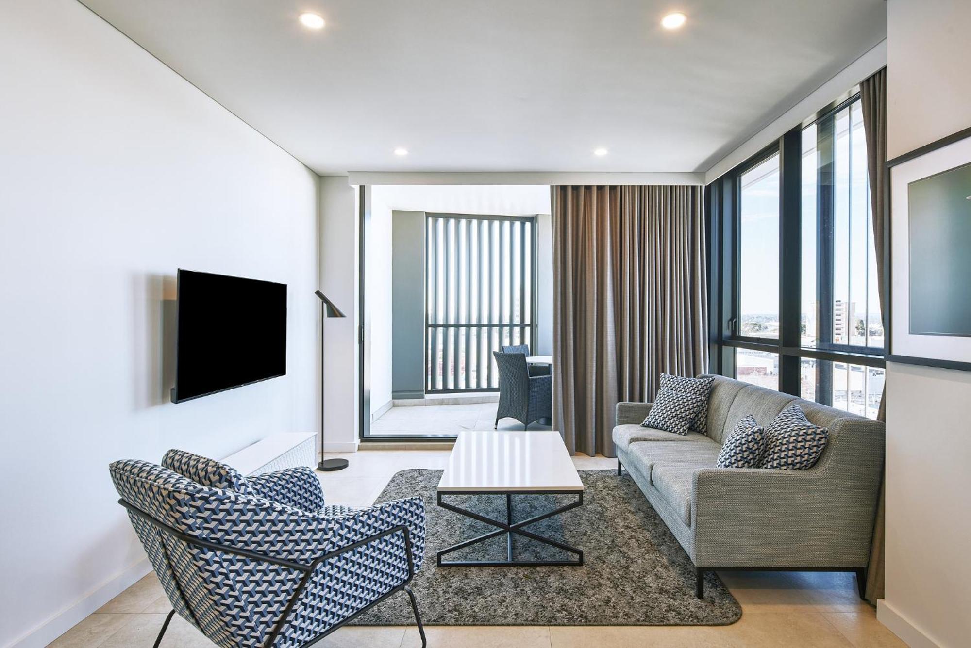 Meriton Suites Liverpool Exterior photo A living room in a typical apartment